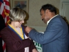 Web Shailesh Gives Pin to Shailesh Shah pins Citizen of the year Donna Miller 003.JPG